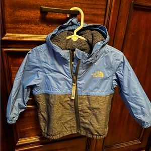 Children’s North Face fleece lined jacket. Blue 6-12 months